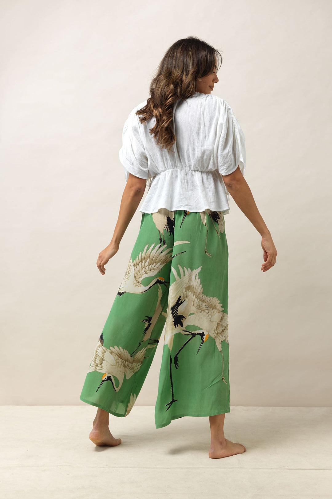 Women's palazzo pants trousers crepe in in pea green and white stork print by One Hundred Stars