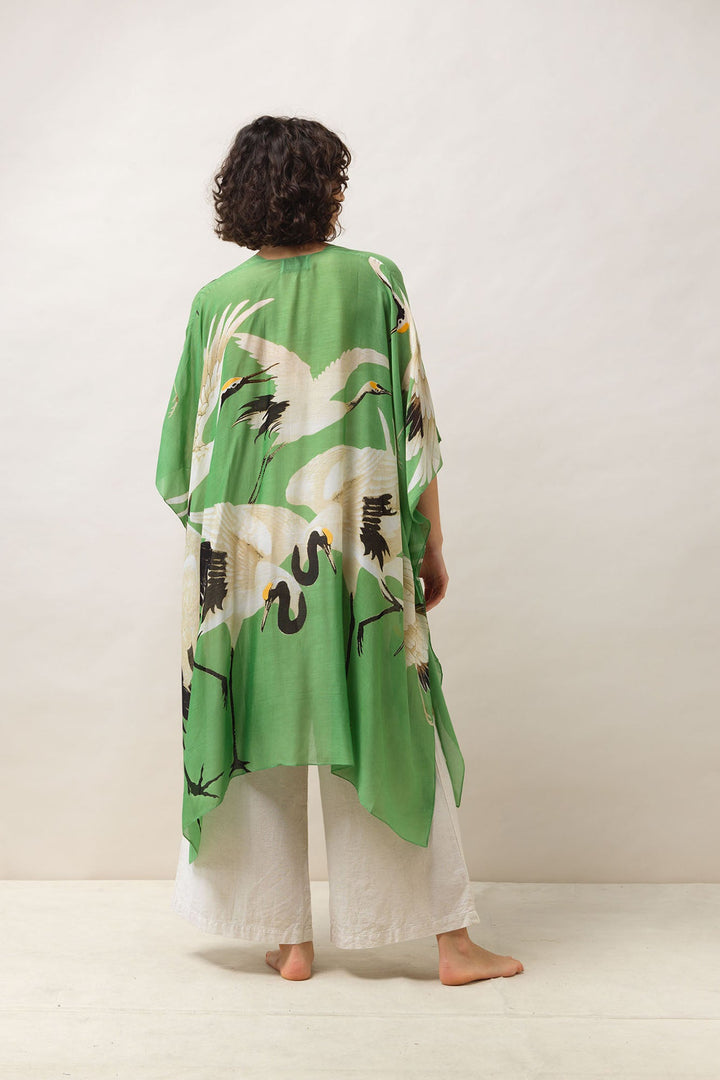 Women's lightweight throwover shawl in pea green and white stork print by One Hundred Stars